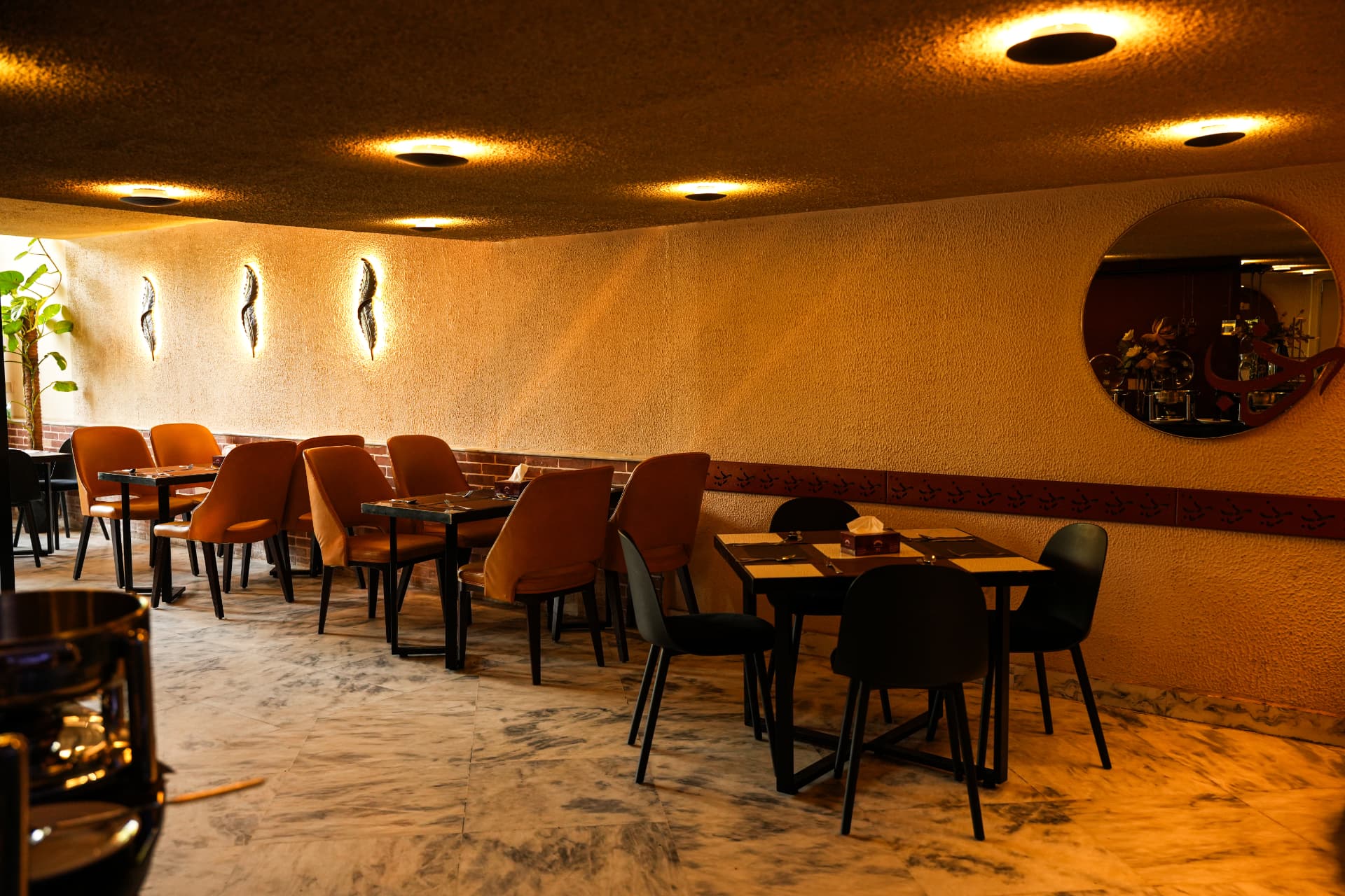 Warm amber-lit Steak Studio dining room